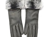 A pair of elegant women's gloves made from black lambskin leather with a luxurious gray chinchilla fur trim at the wrist.